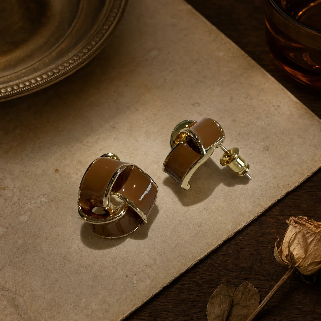 Brown geometric stud earrings styled product image