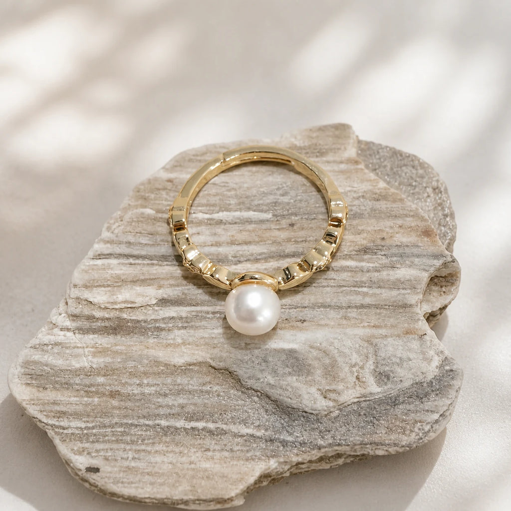Petite freshwater pearl ring in gold styled on stone with round pearl detail