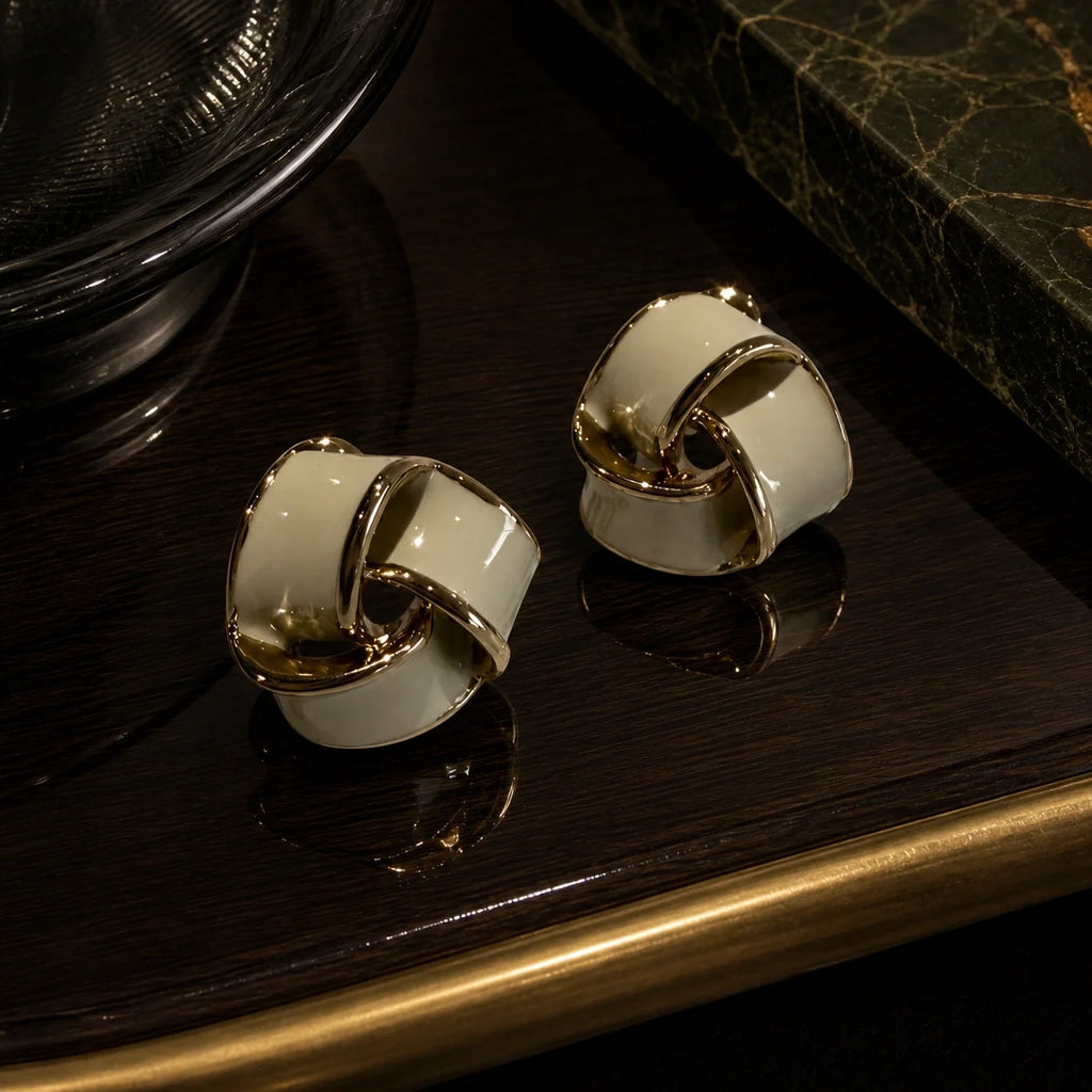 Cream geometric stud earrings styled product image
