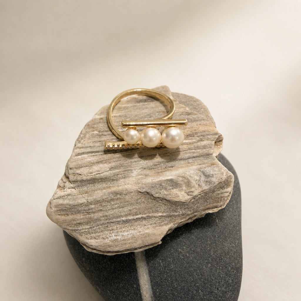 French triple pearl ring in gold styled on stone with white pearl detail