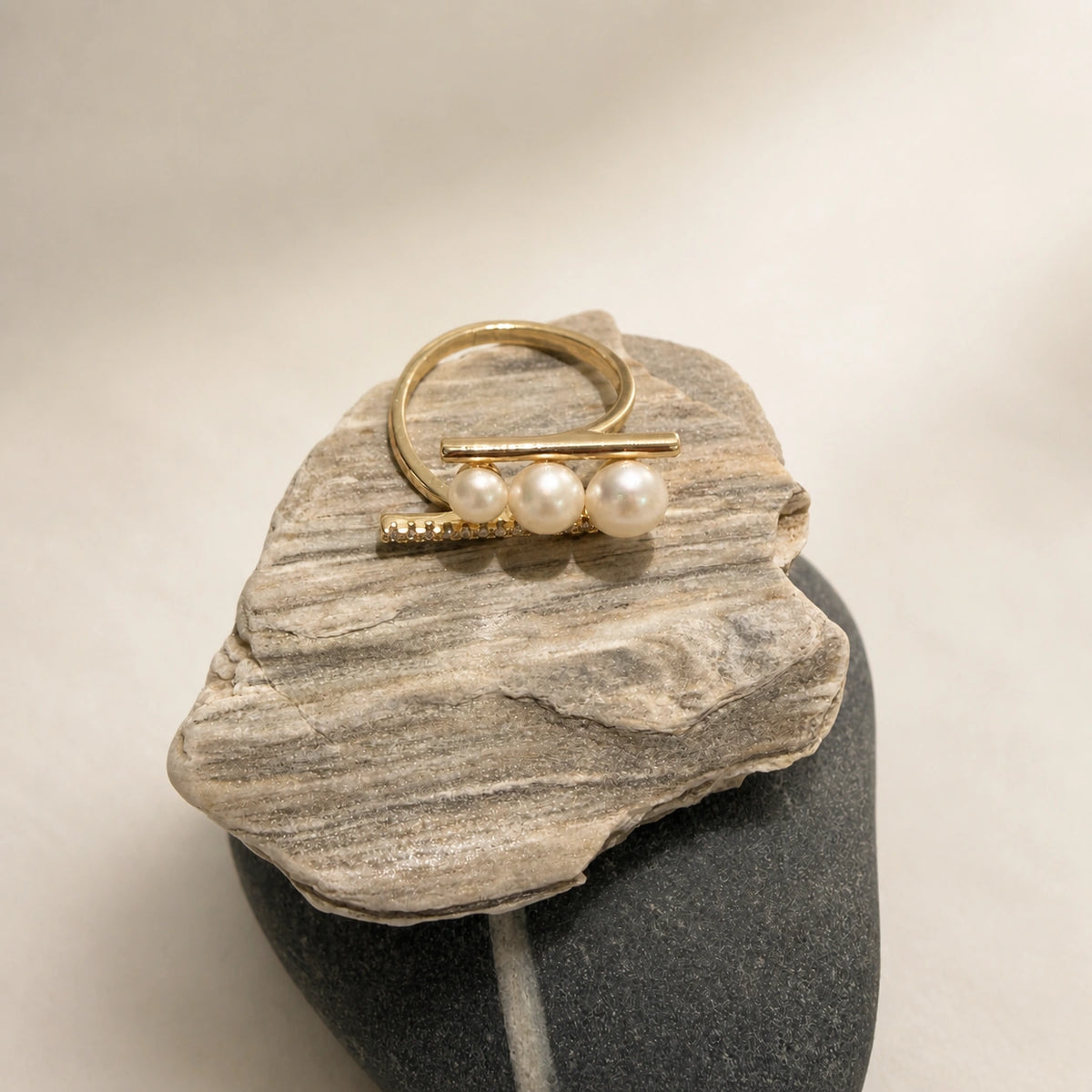 French triple pearl ring in gold styled on stone with white pearl detail