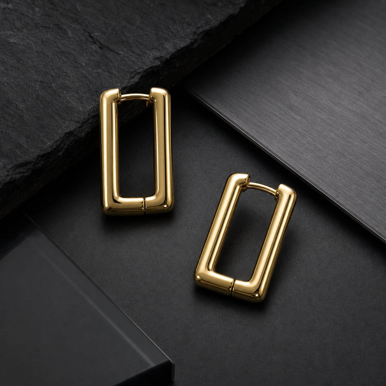 Geometric rectangular gold earrings close-up product image