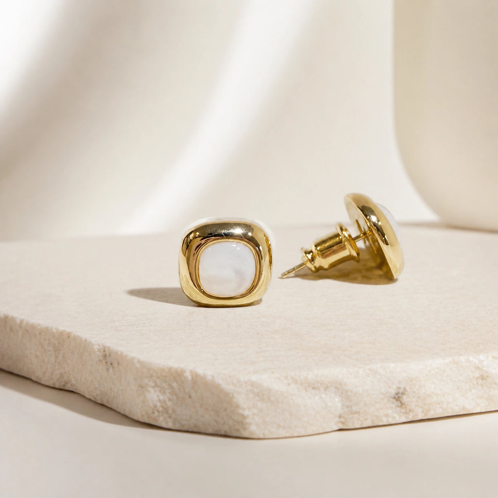 Mother-of-pearl stud earrings in gold close-up product detail