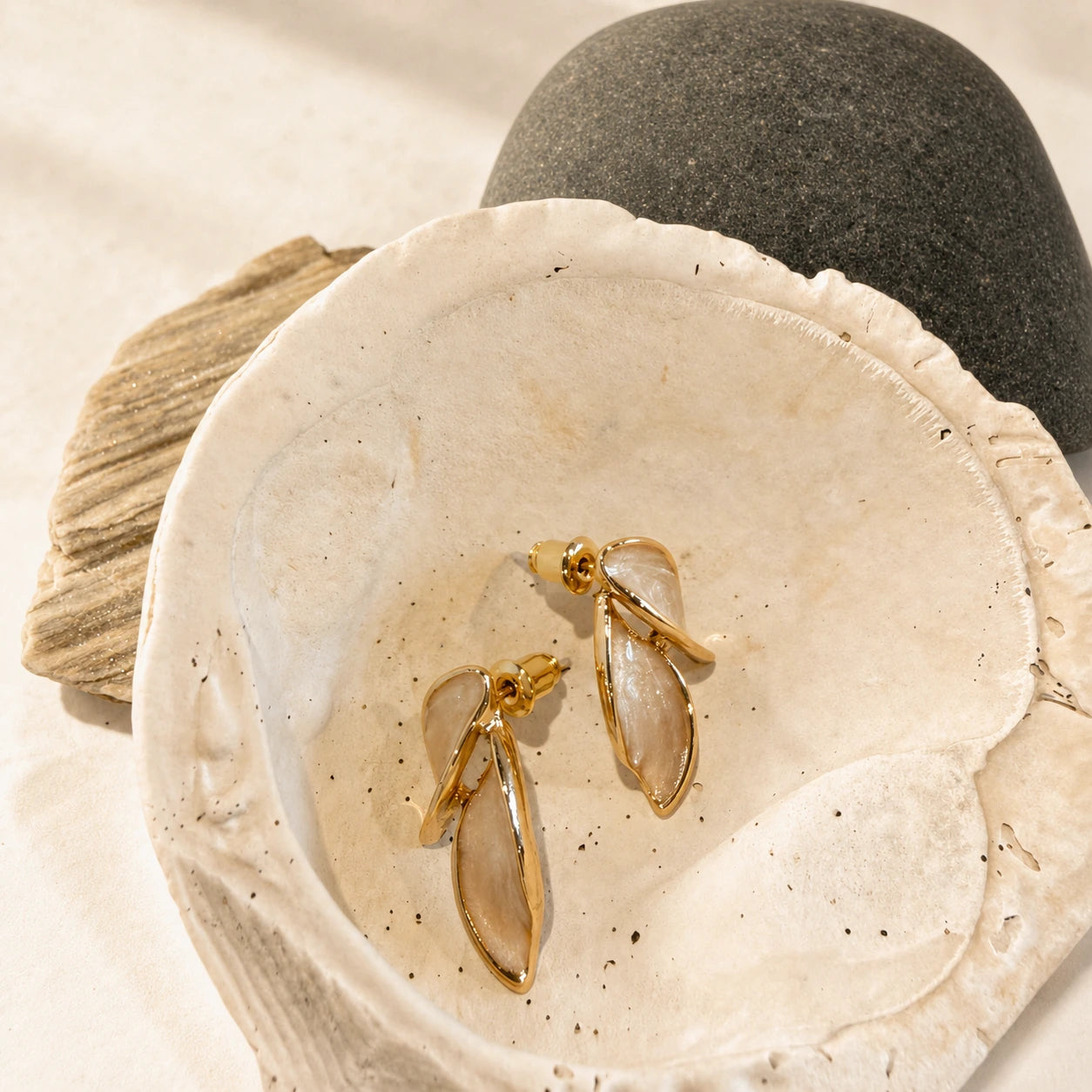Leaf accent earrings in gold product detail image