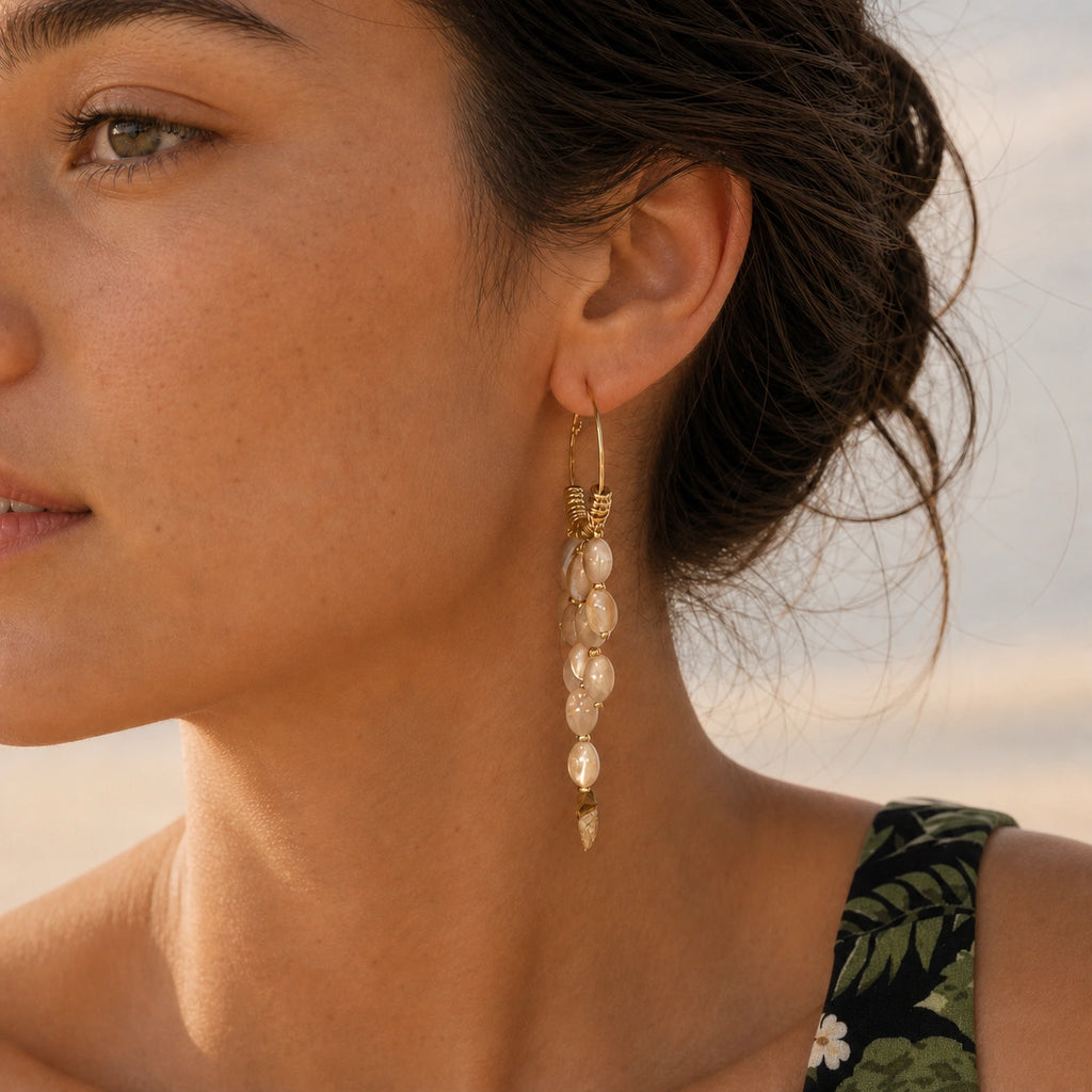 Bohemian pearl tassel drop earrings in gold model wearing close-up