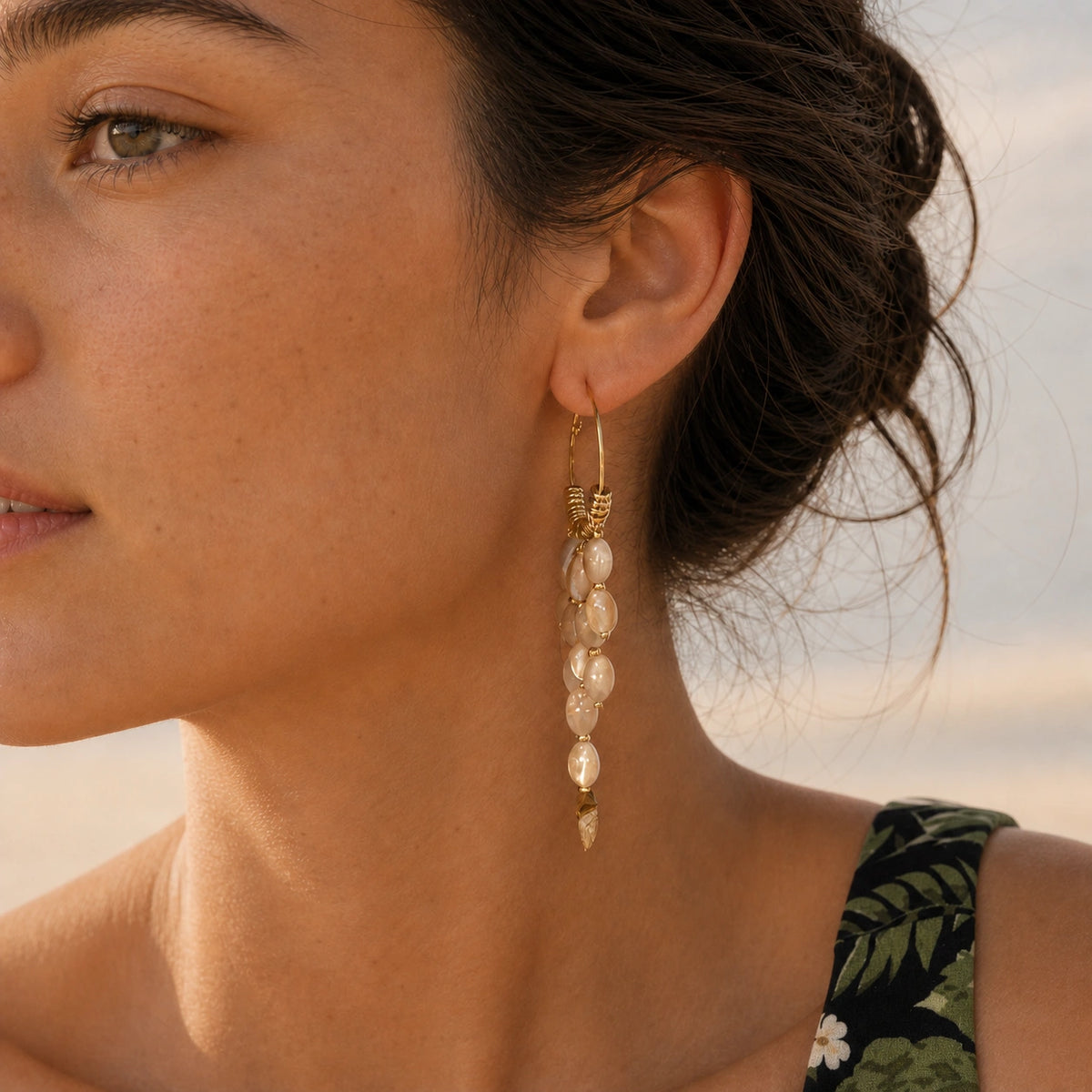Bohemian pearl tassel drop earrings in gold model wearing close-up