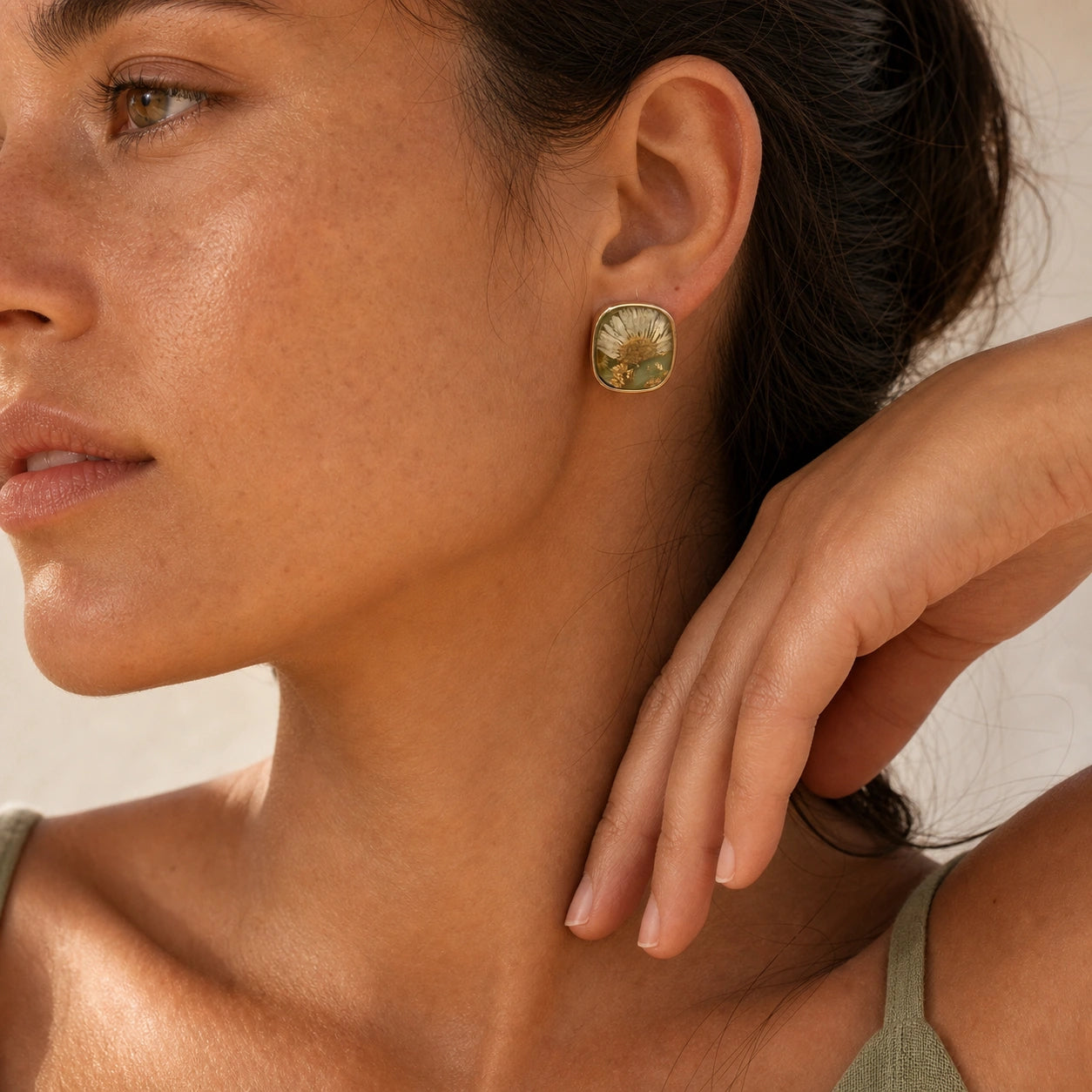White daisy stud earrings model wearing close-up