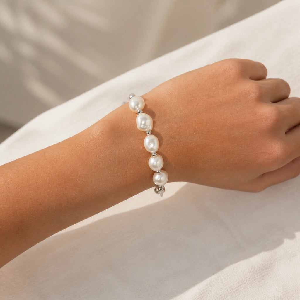Silver baroque freshwater pearl bracelet worn close-up