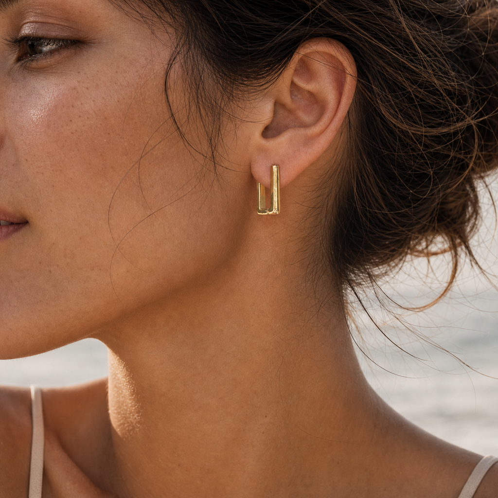 Geometric rectangular gold earrings editorial product image