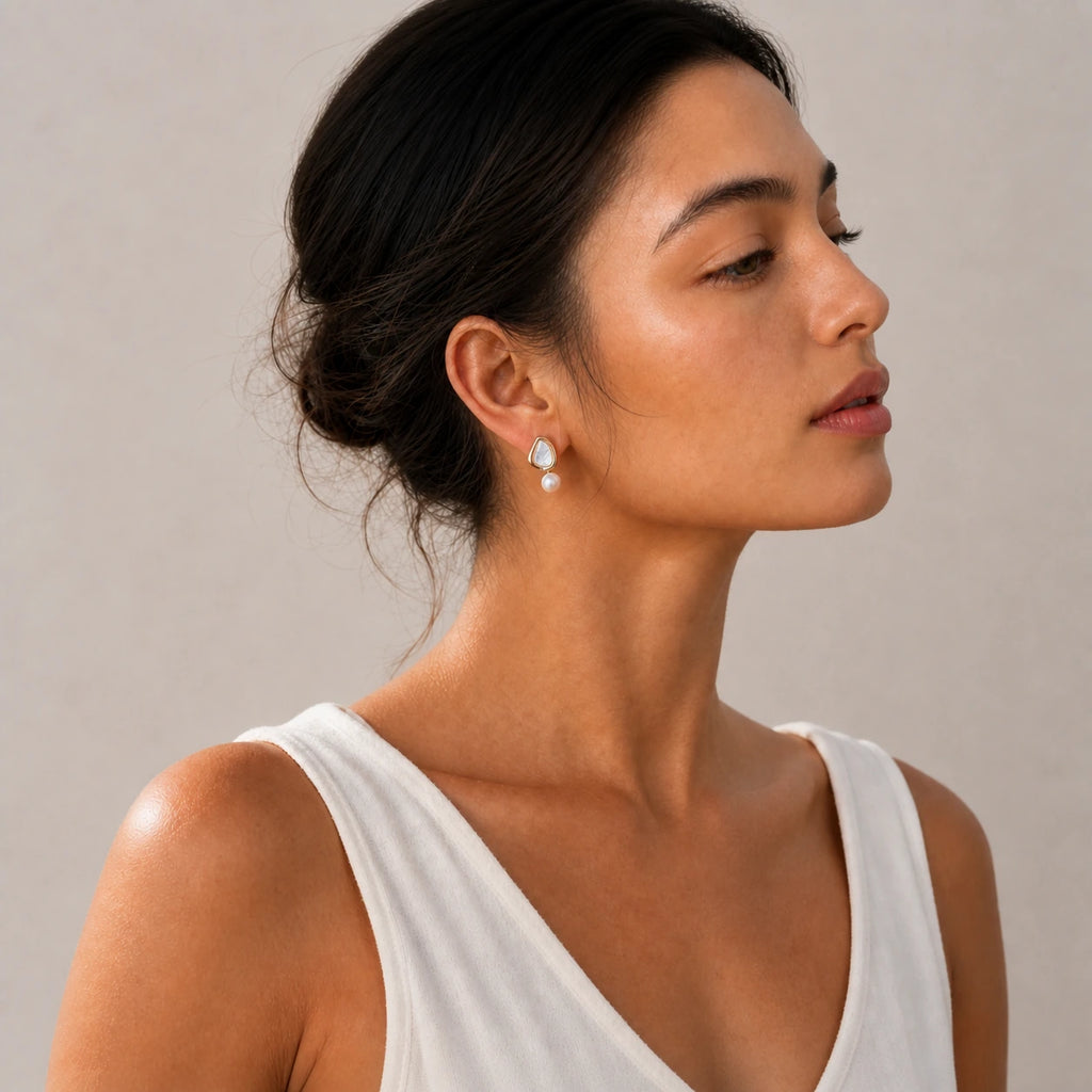 Triangle pearl stud earrings model wearing shoulder view