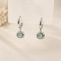 Cat's Eye Drop Earrings in Gold-plated brass with 925 sterling silver hooks displayed in a product styling scene.
