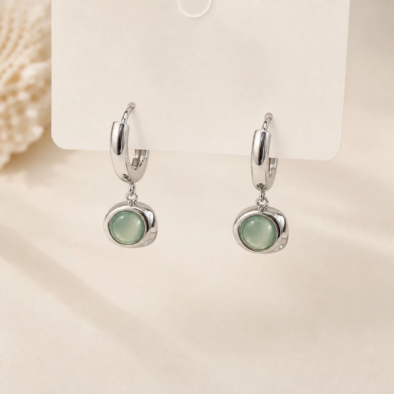 Cat's Eye Drop Earrings in Gold-plated brass with 925 sterling silver hooks displayed in a product styling scene.