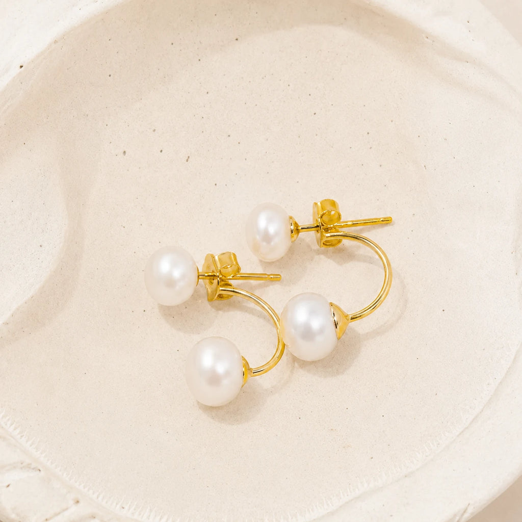Double Pearl Jacket Earrings in Gold-plated 925 sterling silver displayed in a product styling scene.