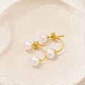 Double Pearl Jacket Earrings in Gold-plated 925 sterling silver displayed in a product styling scene.