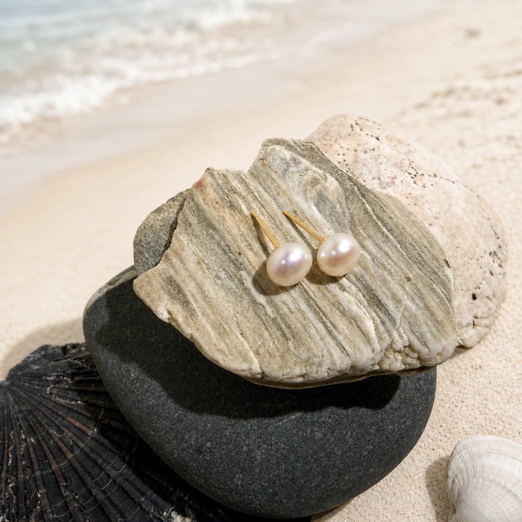 Freshwater Pearl Earrings 7-8mm in 925 sterling silver displayed in a product styling scene.