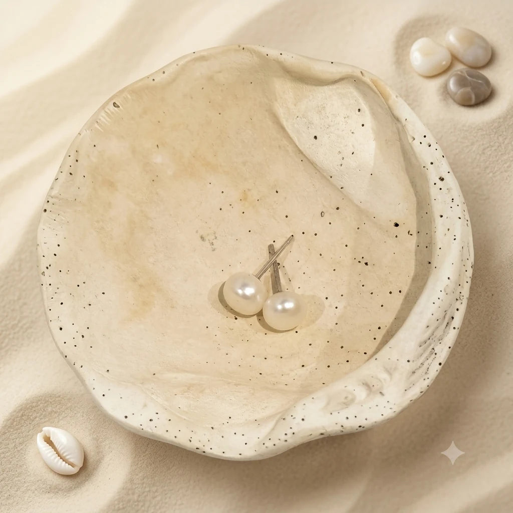 Freshwater Pearl Earrings 7-8mm in 925 sterling silver displayed in a product styling scene.