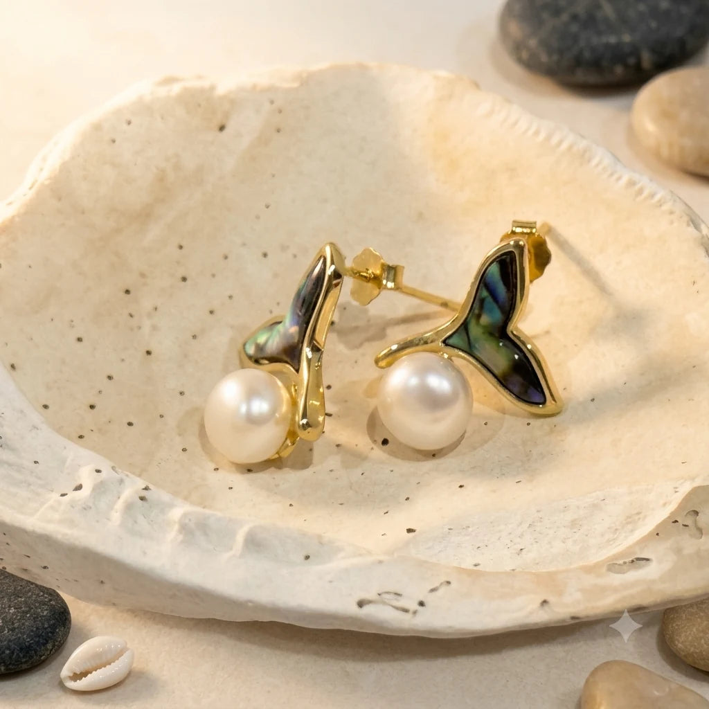 Close-up of freshwater pearl earrings in Gold-plated brass with 925 sterling silver posts.