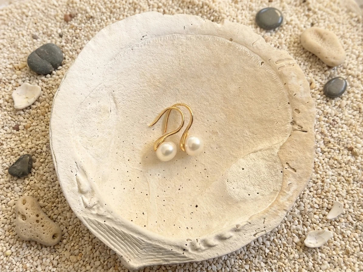 Close-up of freshwater pearl hook earrings 8mm in Gold-plated 925 sterling silver.