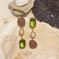 Green Stone Drop Earrings in Gold-plated brass with 925 sterling silver hooks displayed in a product styling scene.