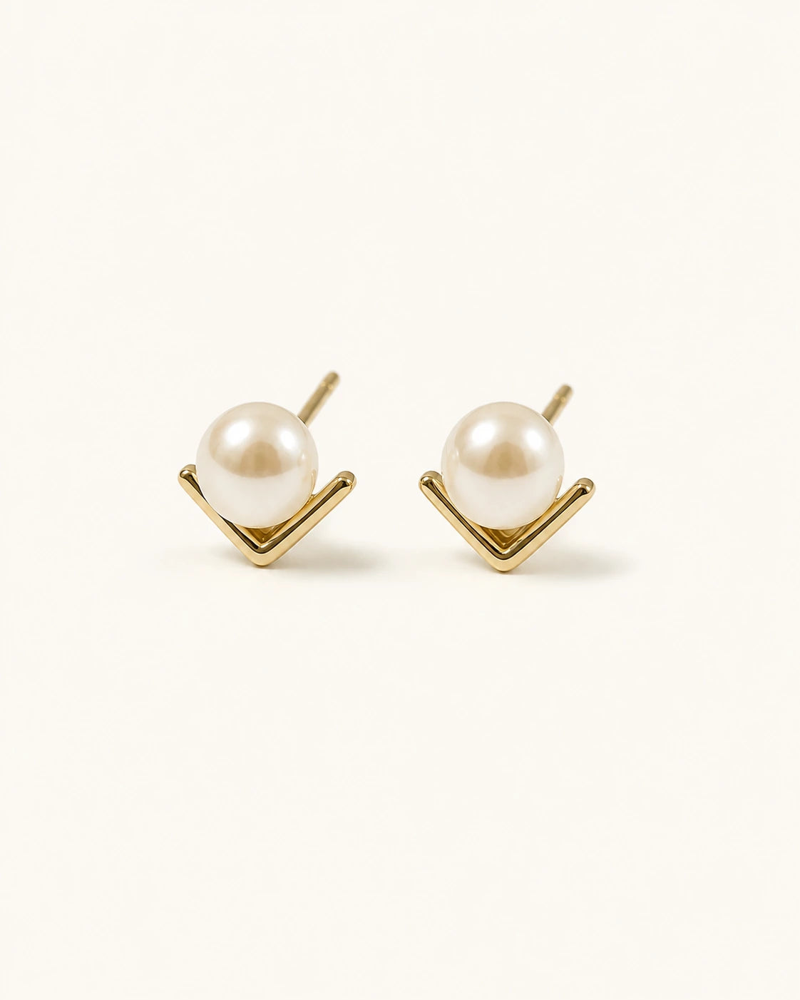 V-shaped pearl stud earrings product image in gold-plated brass