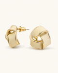 Cream geometric stud earrings white background product image