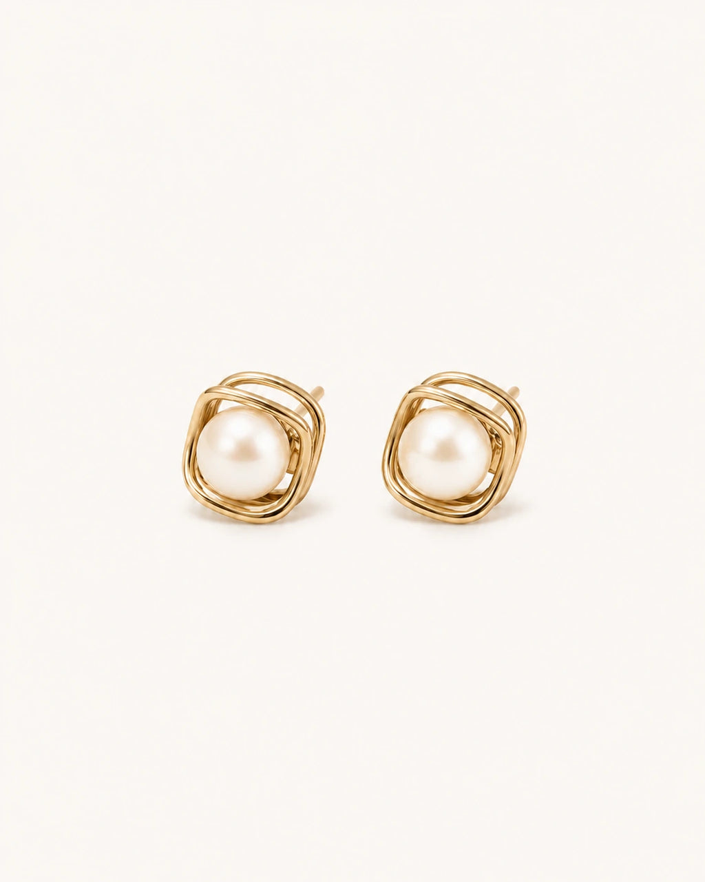 Square pearl stud earrings in gold white background main image