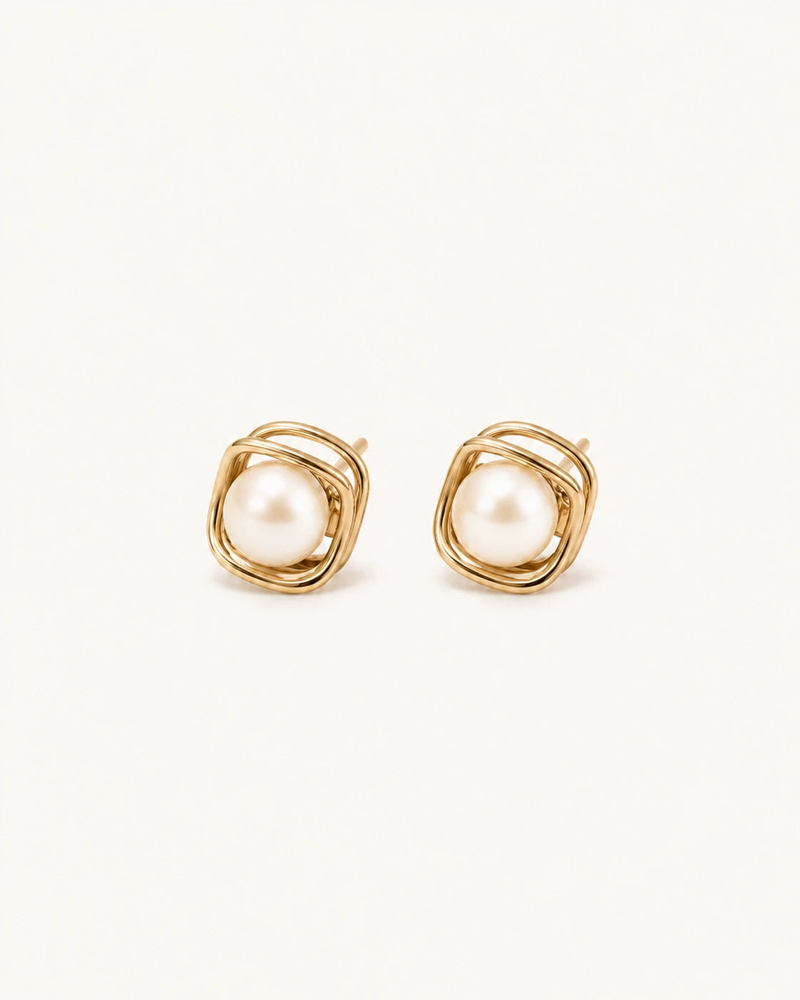 Square pearl stud earrings in gold white background main image