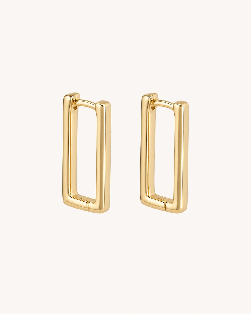 Geometric rectangular gold earrings white background main image