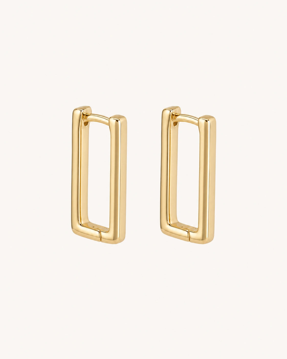 Geometric rectangular gold earrings white background main image
