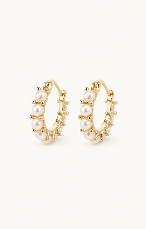 Mini pearl huggie earrings white background main image