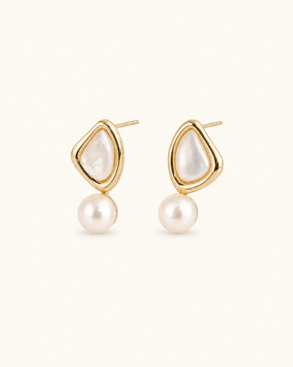 Triangle pearl stud earrings white background product image