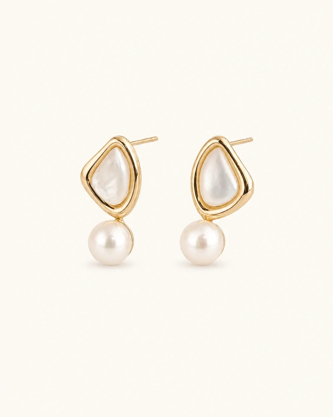 Triangle pearl stud earrings white background product image