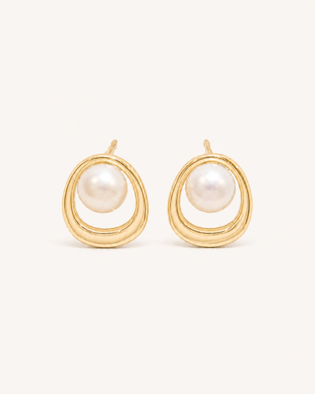 Pearl circle stud earrings in gold white background product image