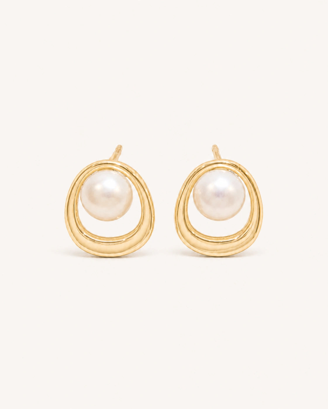 Pearl circle stud earrings in gold white background product image