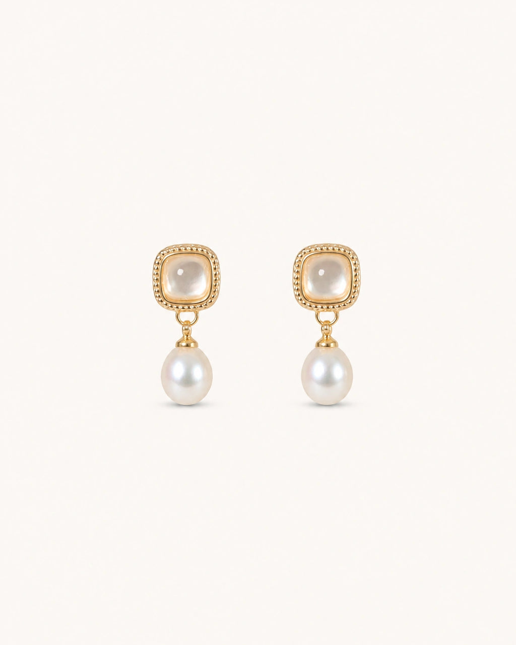 Vintage mother-of-pearl pearl drop earrings in gold white background product image