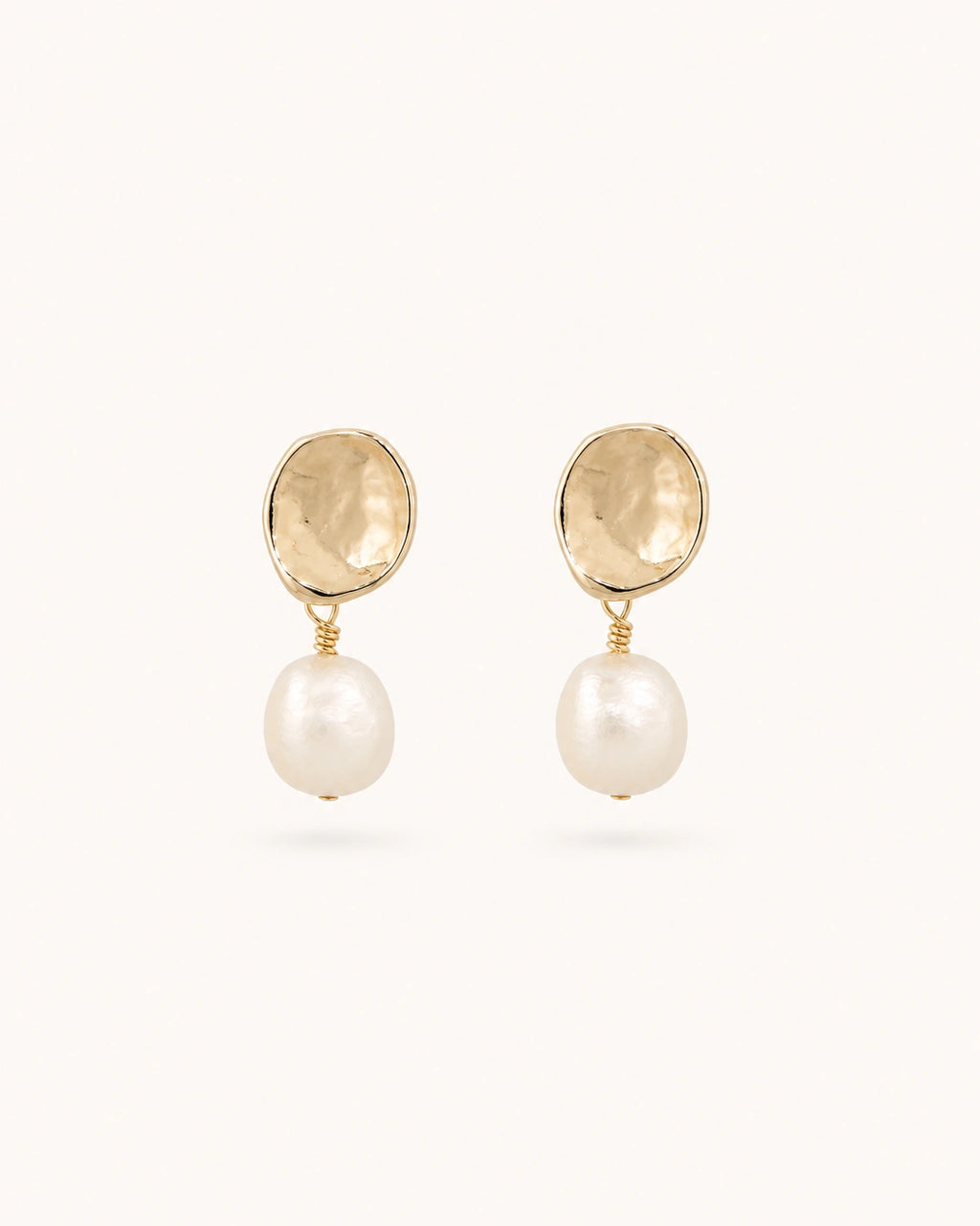 Petite baroque pearl drop earrings in gold on clean white background