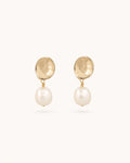 Petite baroque pearl drop earrings in gold on clean white background