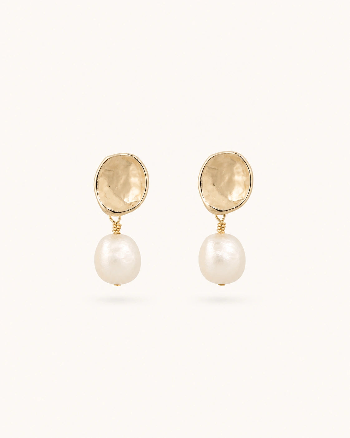 Petite baroque pearl drop earrings in gold on clean white background
