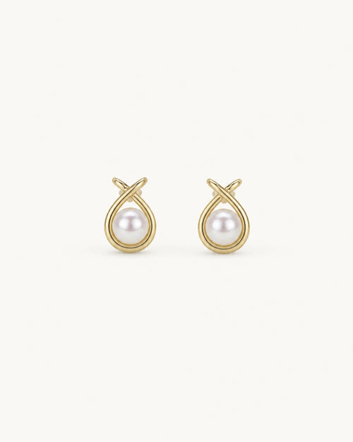 Pearl halo stud earrings in gold white background product image