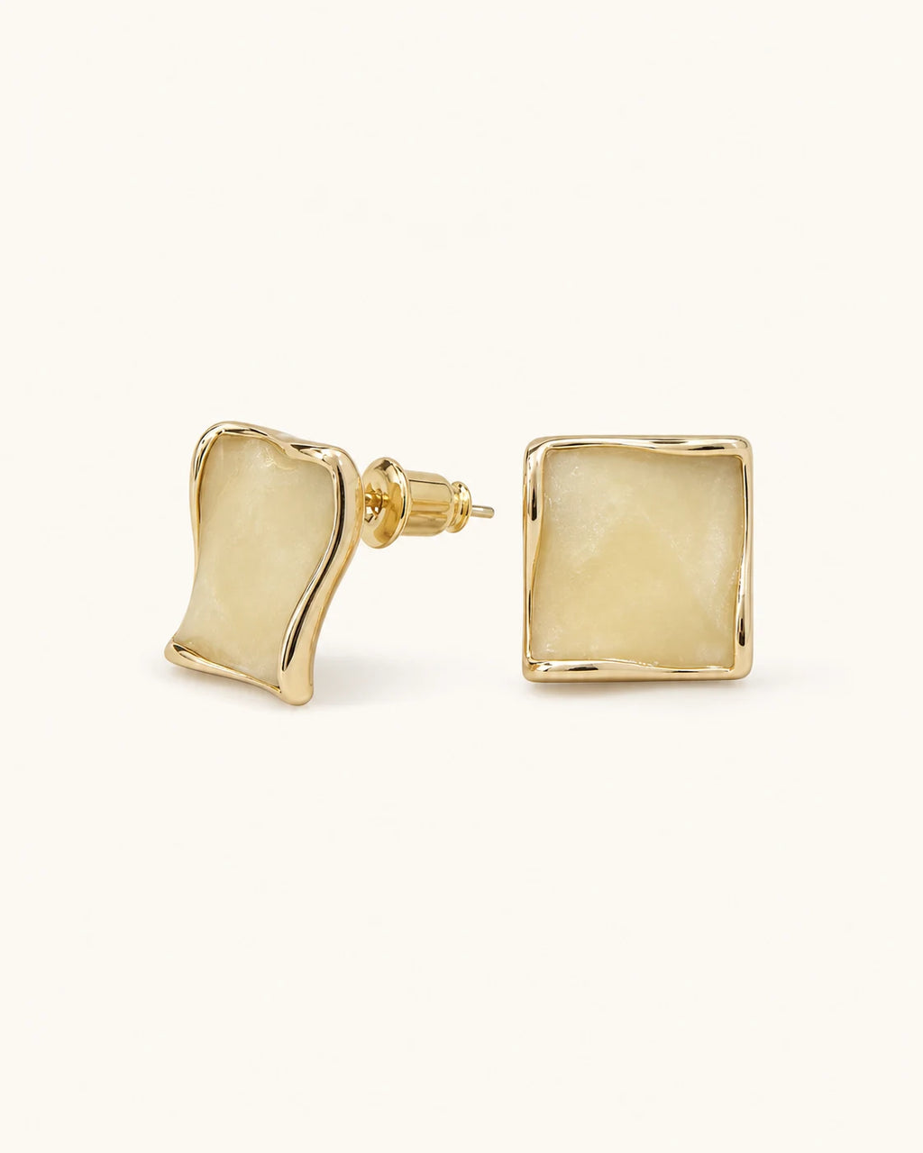 Butter yellow square stud earrings in gold on clean white background