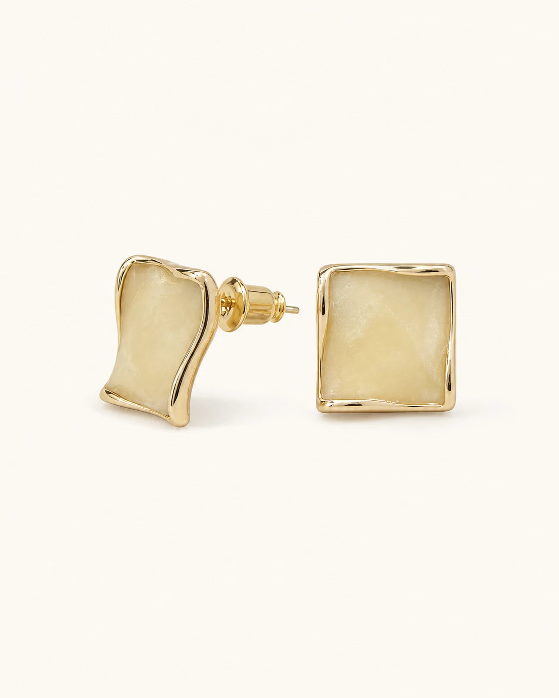 Butter yellow square stud earrings in gold on clean white background
