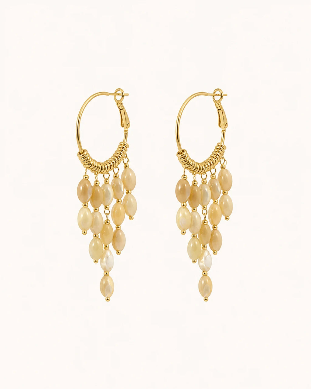 Bohemian pearl tassel drop earrings in gold on clean white background