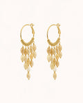 Bohemian pearl tassel drop earrings in gold on clean white background