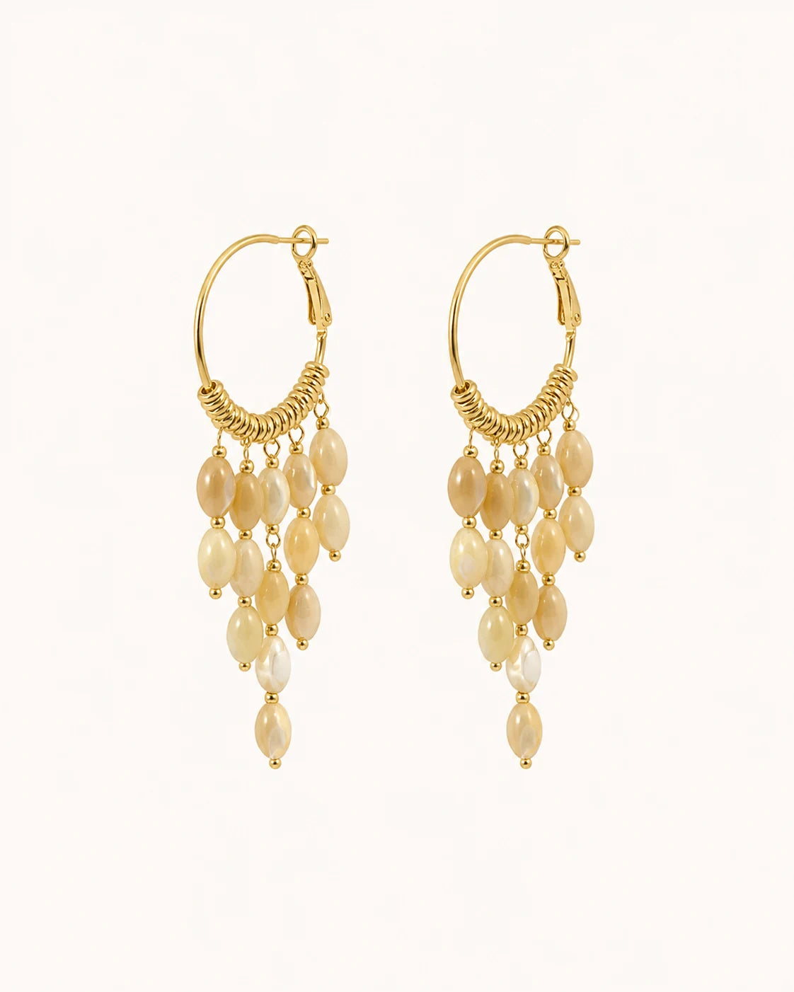 Bohemian pearl tassel drop earrings in gold on clean white background
