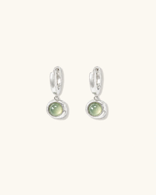 Green cat's eye drop earrings in silver white background product image