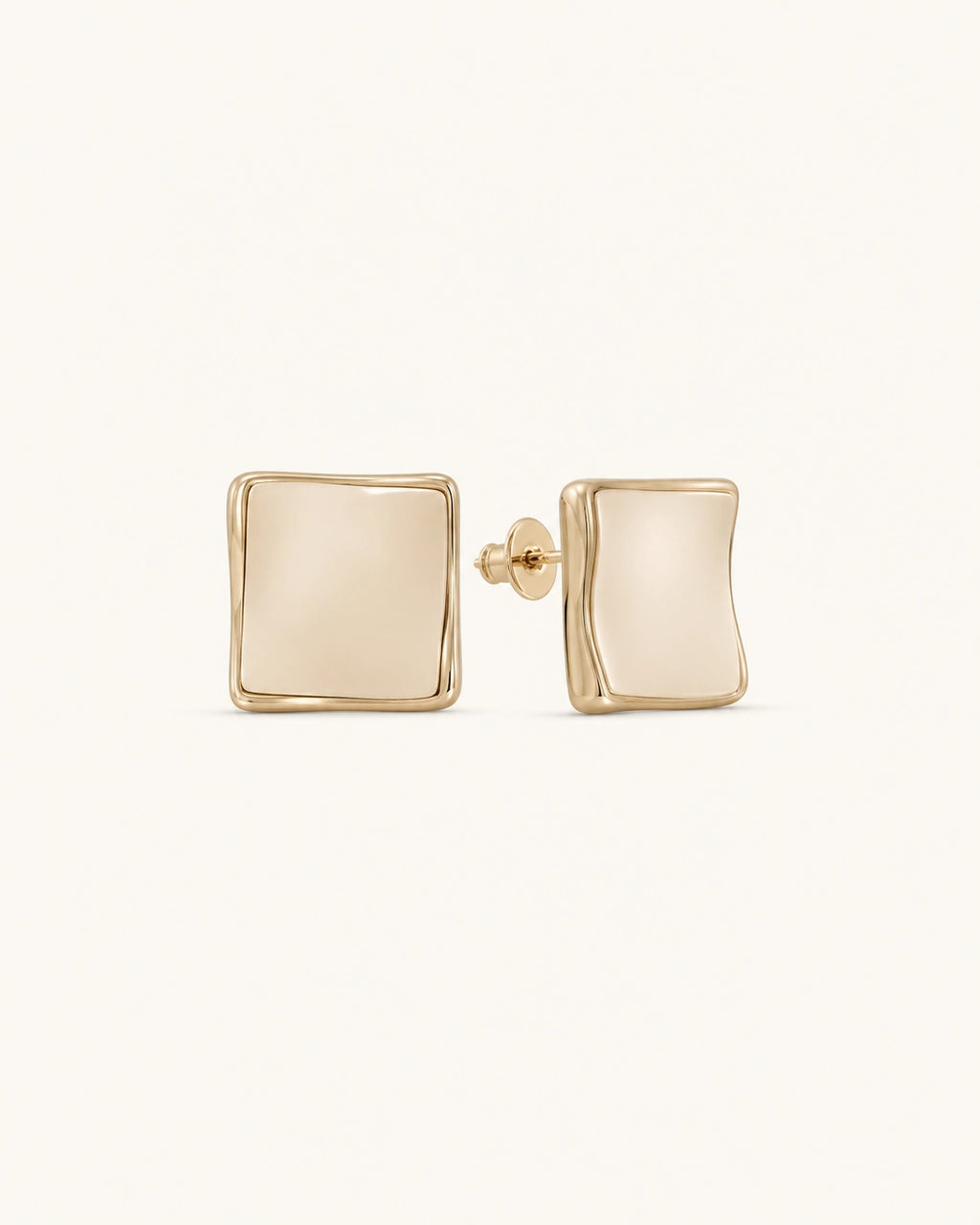Cream square stud earrings in gold on clean white background