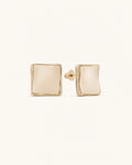 Cream square stud earrings in gold on clean white background