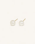 Classic white pearl stud earrings in gold white background product image