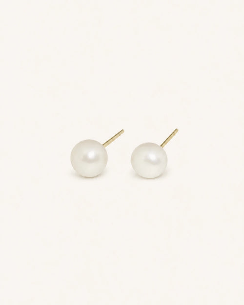Classic white pearl stud earrings in gold white background product image