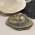 Mermaid Pearl Ring in Gold-plated brass displayed in a product styling scene.